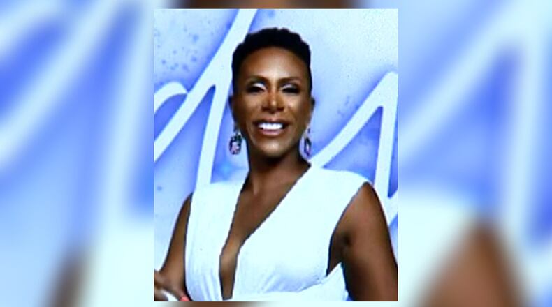 Melody Coburn's car was being loaded onto a tow truck when she was hit near Fulton Industrial Boulevard early Monday morning.