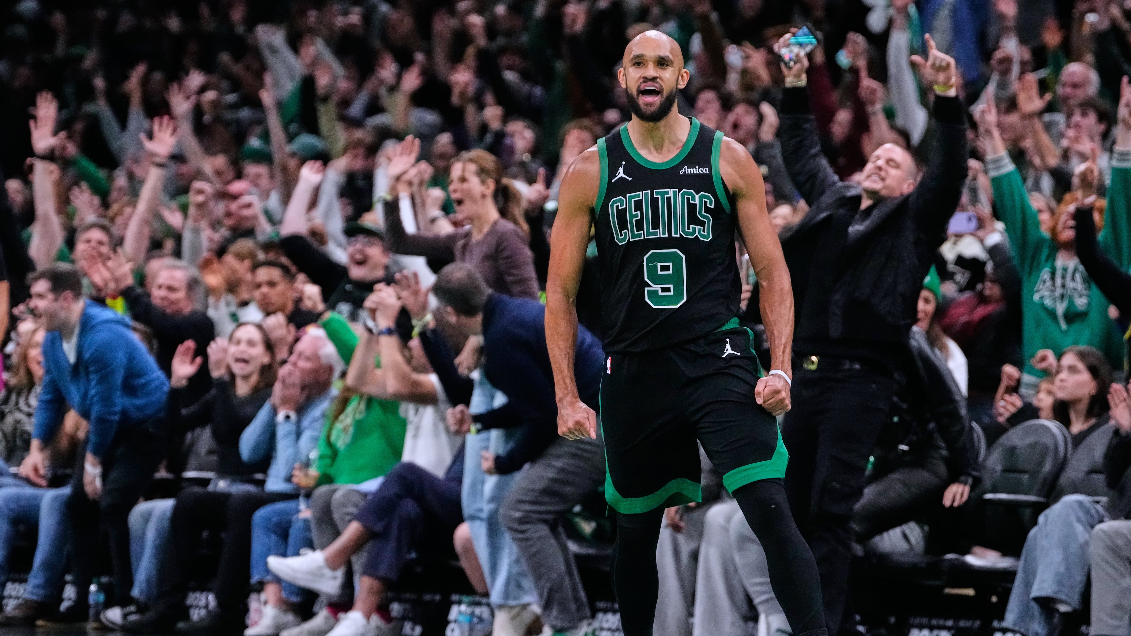 Boston Celtics guard Derrick White (9) celebrates after hitting a there-pointer late in the second half of an Emirates NBA Cup basketball game against the Detroit Pistons, Wednesday, Nov. 26, 2025, in Boston. (AP Photo/Charles Krupa)