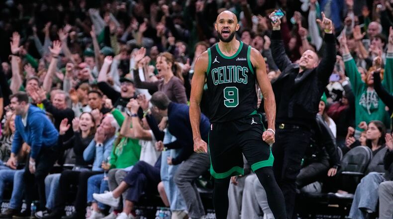 Boston Celtics guard Derrick White (9) celebrates after hitting a there-pointer late in the second half of an Emirates NBA Cup basketball game against the Detroit Pistons, Wednesday, Nov. 26, 2025, in Boston. (AP Photo/Charles Krupa)