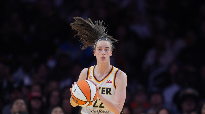 Indiana Fever guard Caitlin Clark (22) dribbles during the first half of a WNBA basketball game against the Los Angeles Sparks Wednesday, May 13, 2026, in Los Angeles. (AP Photo/Jae C. Hong)