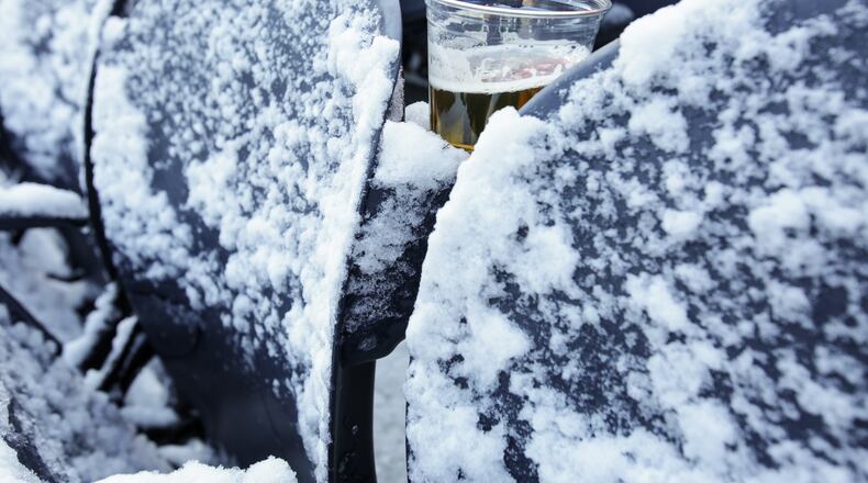 CHICAGO, IL - NOVEMBER 22: A beer sits between snow covered seats prior to the NFL game between the Chicago Bears and the Denver Broncos at Soldier Field on November 22, 2015 in Chicago, Illinois. (Photo by Kena Krutsinger/Getty Images)
