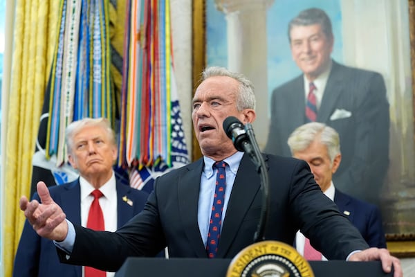 Robert F. Kennedy, Jr. (center) is the Trump administration's secretary of health and human services.