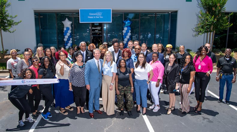 Gov. Brian Kemp (center) posed with Clayton County officials and GlassesUSA officials at a ribbon-cutting ceremony on May 30, 2024.