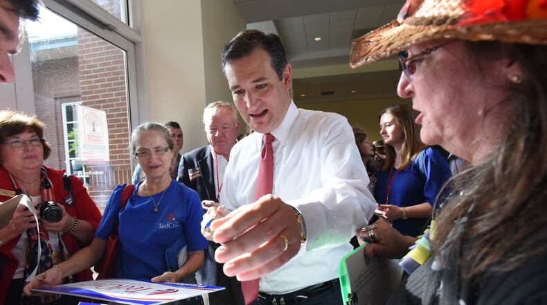 Ted Cruz, a GOP candidate for president, signs an autograph for his supporter Deb Marks (right) of Columbia, S.C., during the Georgia Republican party state convention in Athens on Friday. Hyosub Shin, hshin@ajc.com
