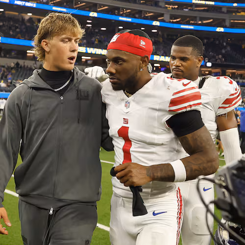 New York Giants quarterback Jaxson Dart, left, walks off the field with wide receiver Malik Nabers (1) after an NFL football game against the Los Angeles Rams in Inglewood, Calif., Monday, Sept. 21, 2026. (AP Photo/Caroline Brehman)