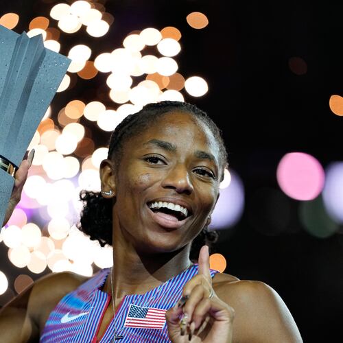 Melissa Jefferson-Wooden, of the United States, poses with her trophy after winning the women's 200 meters final at the World Athletics Ultimate Championship in Budapest, Hungary, Sunday, Sept. 13, 2026. (AP Photo/Matthias Schrader)