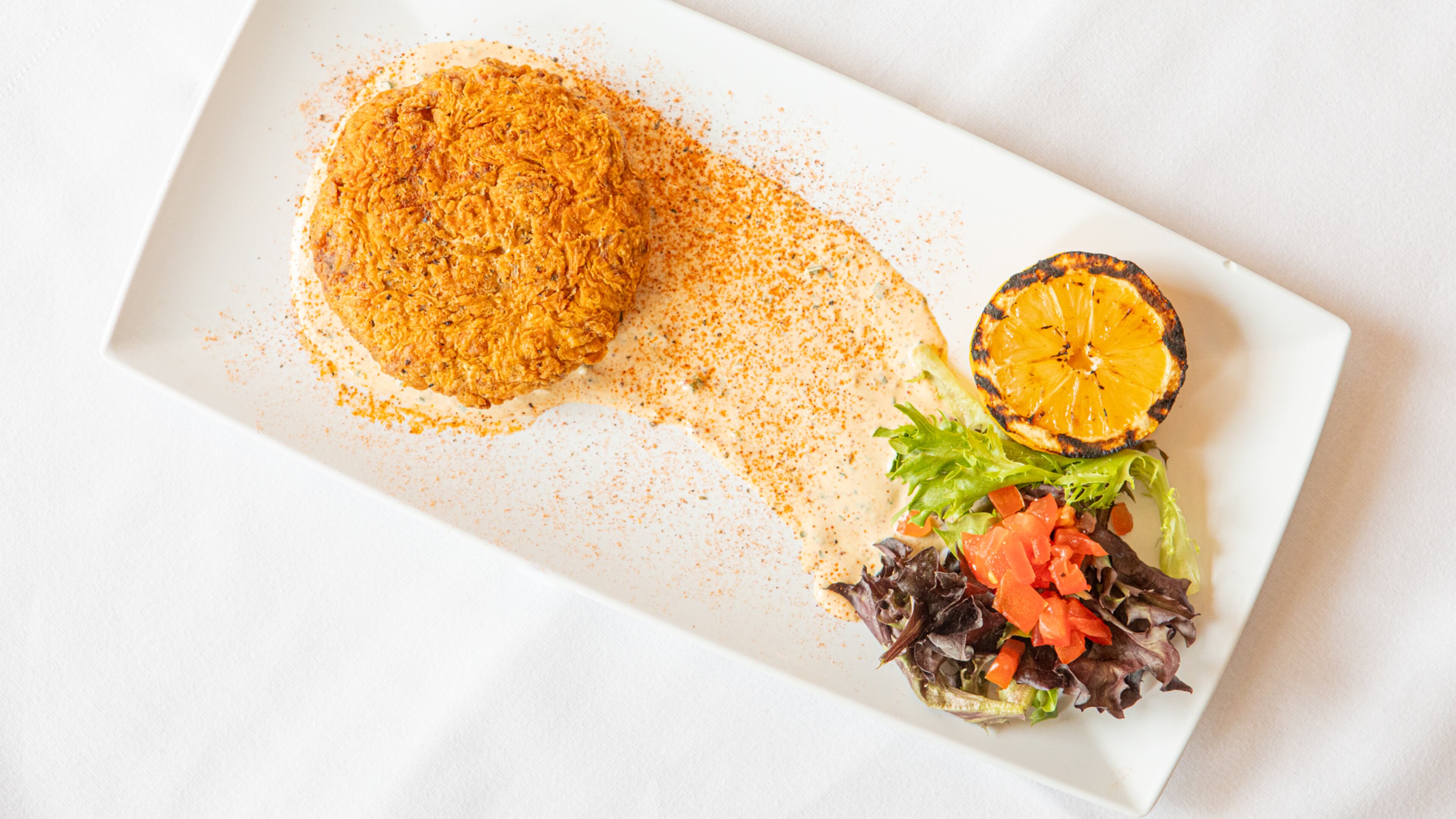 Crawfish cakes are one of Cherokee Rose Restaurant's most popular menu items. (Aaliyah Man for the AJC)