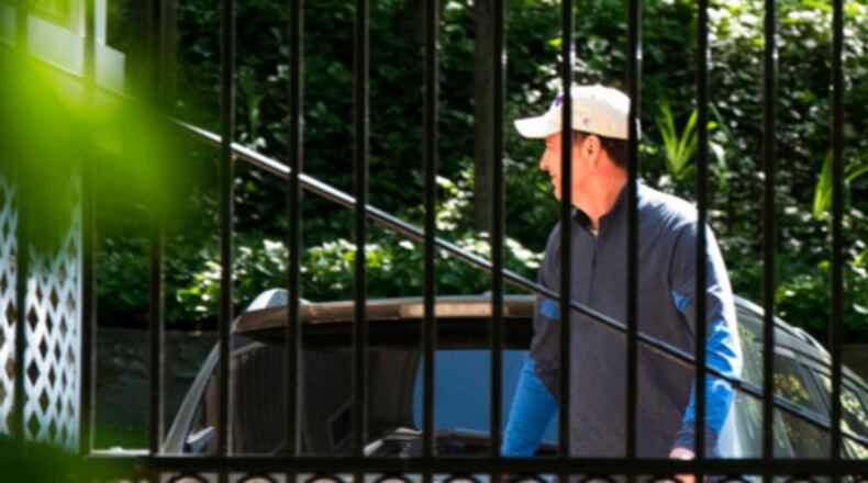 Former FBI Director James Comey walks at his home in McLean, Va., Wednesday, May 10, 2017. President Donald Trump fired Comey on Tuesday, ousting the nation's top law enforcement official in the midst of an investigation into whether Trump's campaign had ties to Russia's election meddling. (AP Photo/Sait Serkan Gurbuz)