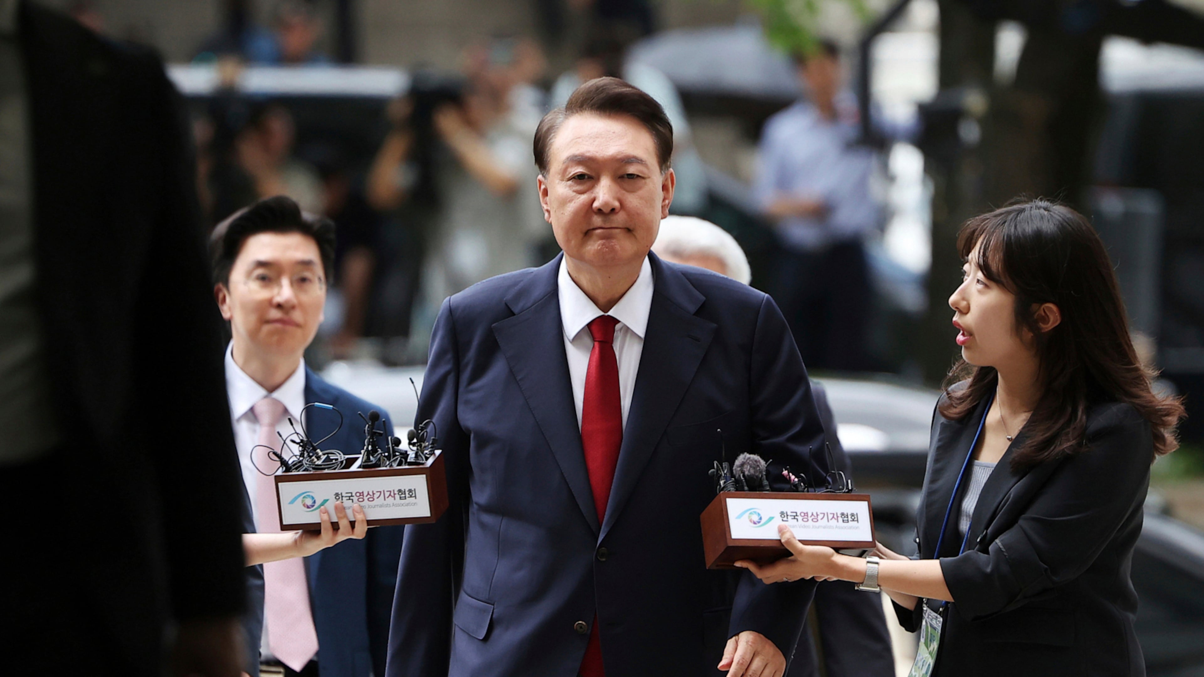 FILE - Former South Korean President Yoon Suk Yeol, center, arrives at a court to attend a hearing to review his arrest warrant requested by special prosecutors in Seoul, South Korea, on July 9, 2025. (Kim Hong-Ji/Pool Photo via AP, File)