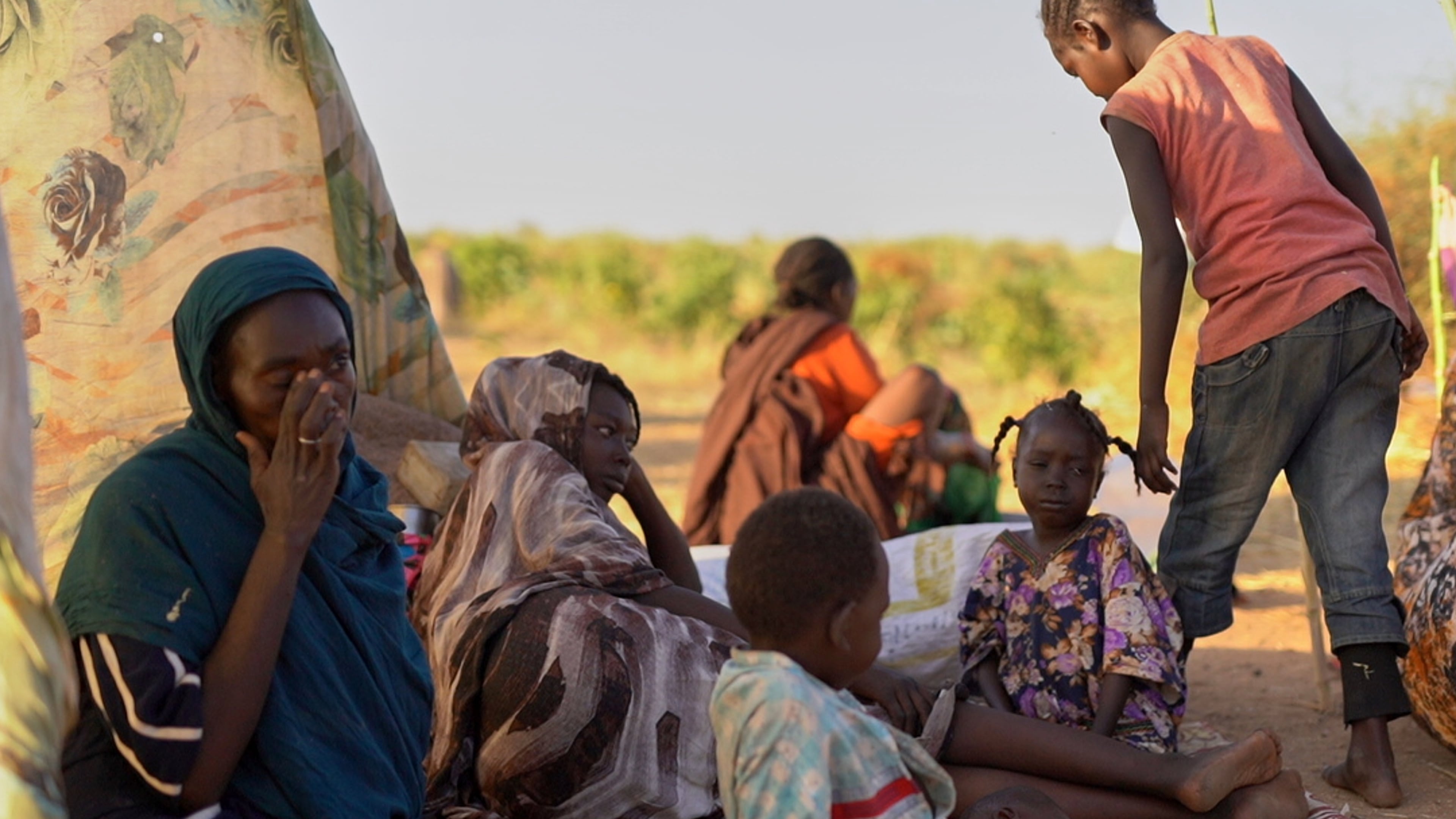 This photo released by UNICEF shows displaced children and families from el-Fasher at a displacement camp where they sought refuge from fighting between government forces and the RSF, in Tawila, Darfur region, Sudan, Monday, Oct. 27, 2025. (Mohammed Jammal/UNICEF via AP)
