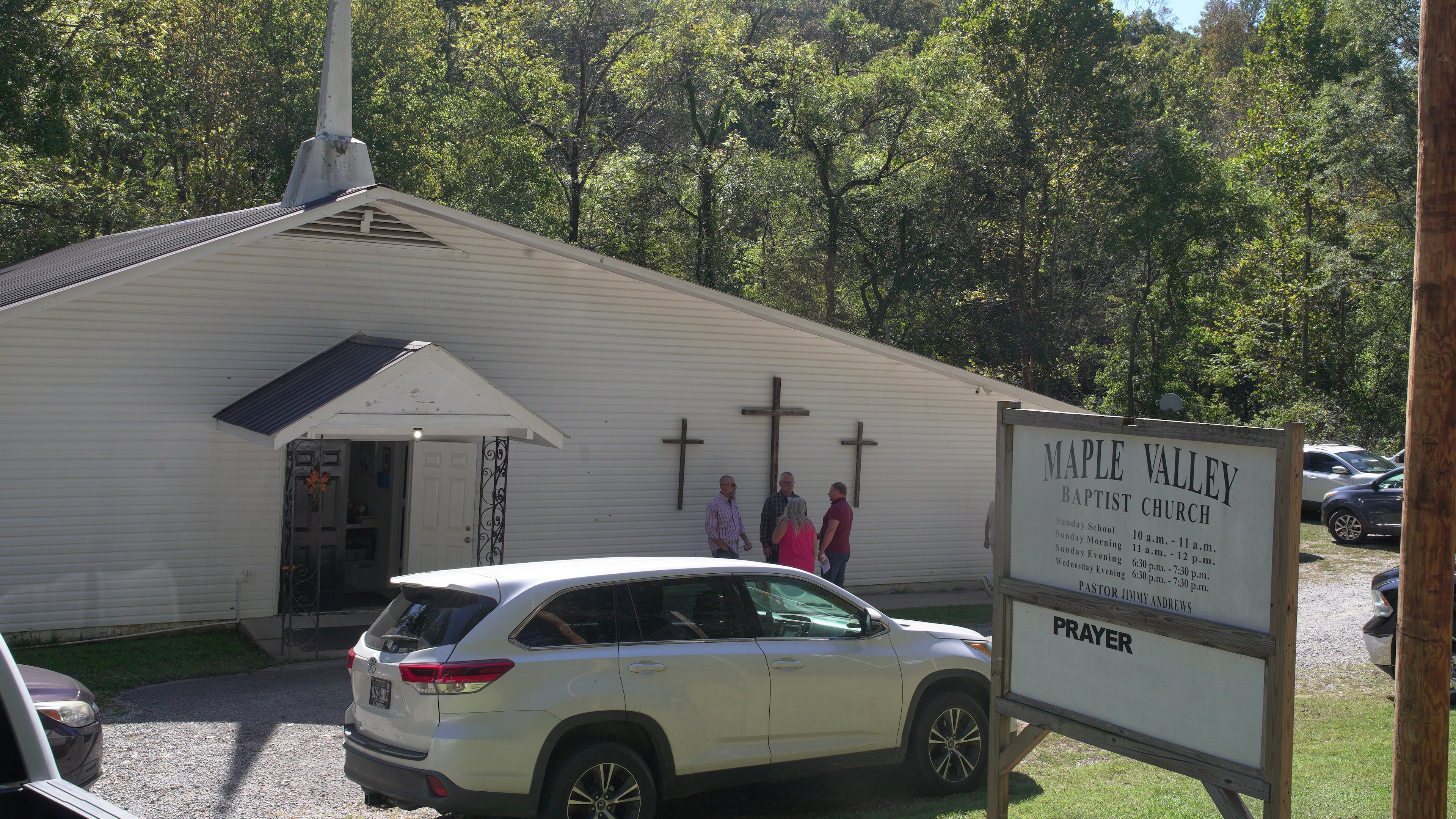 Congregants stand outside Maple Valley Baptist Church in McEwen, Tenn., Sunday, Oct. 12, 2025, about 3 miles from Accurate Energetic Systems, an explosives plant where a blast Friday killed 16 people. (AP Photo/Obed Lamy)