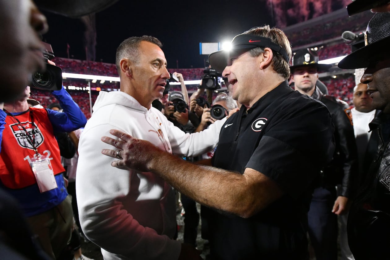 Georgia coach Kirby Smart (right) and Texas coach Steve Sarkisian shake hands after Georgia beat Texas 35-10 on Saturday, Nov. 15, 2025, at Sanford Stadium in Athens. (Hyosub Shin/AJC)