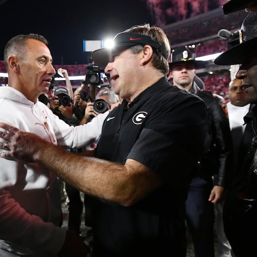 Georgia coach Kirby Smart (right) and Texas coach Steve Sarkisian shake hands after Georgia beat Texas 35-10 on Saturday, Nov. 15, 2025, at Sanford Stadium in Athens. (Hyosub Shin/AJC)