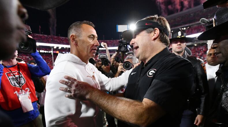Georgia coach Kirby Smart (right) and Texas coach Steve Sarkisian shake hands after Georgia beat Texas 35-10 on Saturday, Nov. 15, 2025, at Sanford Stadium in Athens. (Hyosub Shin/AJC)