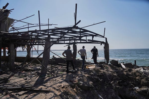 Palestinians check an area of a cafe that was damaged in an Israeli strike, Gaza City, Monday, June 30, 2025. (AP Photo/Jehad Alshrafi)