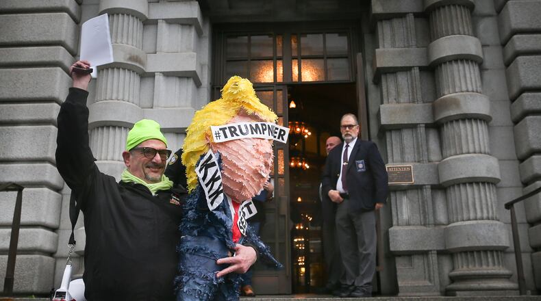 SAN FRANCISCO, CA - FEBRUARY 9: Mihael Petrelis holds up a copy of the appellate court's decision outside a federal appeals court after it ruled against lifting the stay on U.S. President Donald Trump's executive order imposing a temporary immigration ban on seven Muslim-majority nations in San Francisco, California. (Photo by Elijah Nouvelage/Getty Images)