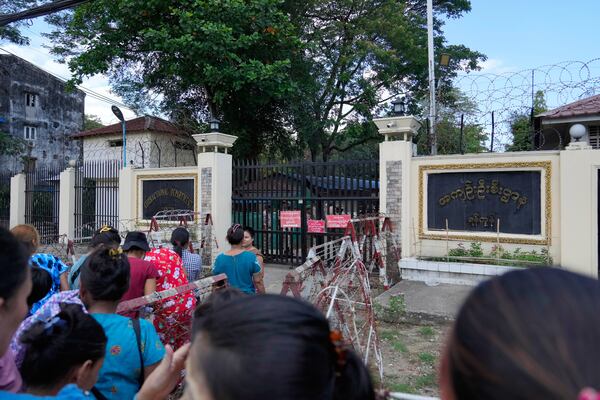 Family members and colleagues wait to welcome released prisoners outside the main gate of Insein prison as the head of Myanmar’s military government granted amnesty to thousands of prisoners to mark the country's traditional New Year Thursday, April 17, 2025, in Yangon, Myanmar. (AP Photo/Thein Zaw)