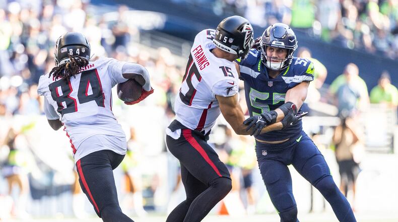 Seattle Seahawks' Cody Barton is taken out of the play by Atlanta Falcons' Feleipe Franks, giving Cordarrelle Patterson room to run for 18-yards in the third quarter on Sunday, Sept. 25, 2022, at Lumen Field in Seattle. (Dean Rutz/The Seattle Times/TNS)