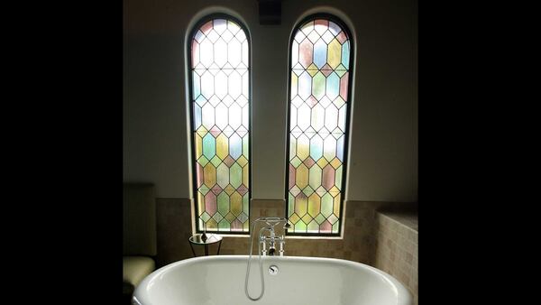 Stained glass windows frame a deep tub that's just right for a relaxing soak in a treatment room at The Spa at the Cloister, a sister property of the Lodge. The room is also used for facials, massages and other treatments.