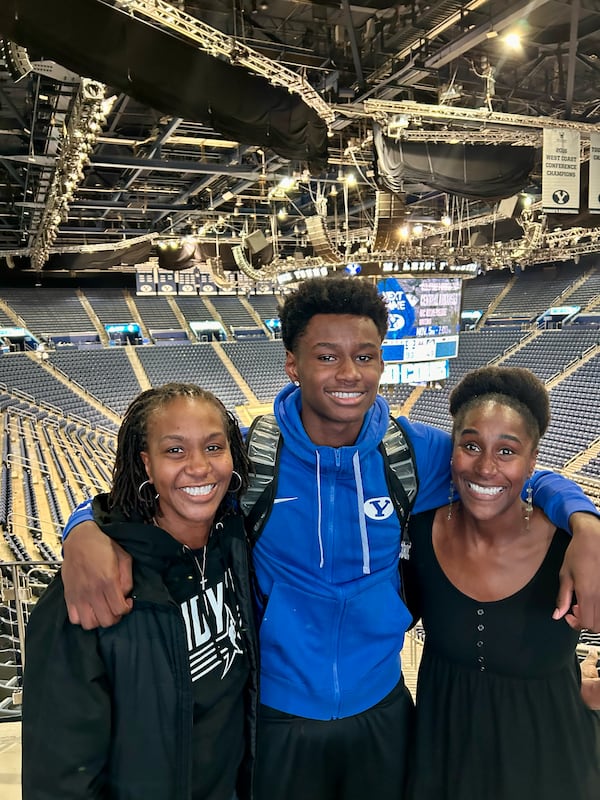 Kanon Catchings (center), now a sophomore forward at Georgia, poses at his previous stop, BYU, with aunt Tamika Catchings (left) and mom Tauja Catchings. (Courtesy of Tauja Catchings) 