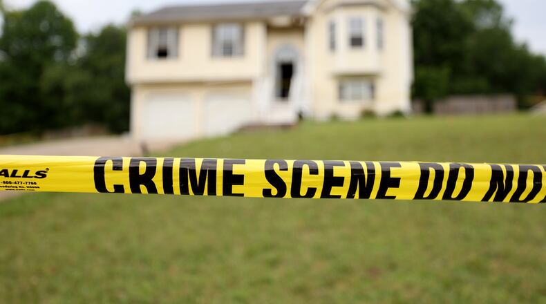 062722 Rockmart, Ga..: Crime scene tape is shown at the home on Woodwind Drive where three children died, Friday in Paulding County, Monday, June 27, 2022, in Rockmart, Ga.. The mother of the children, Darlene Brister, 40, is charged with two counts of malice murder following the deaths. (Jason Getz / Jason.Getz@ajc.com)