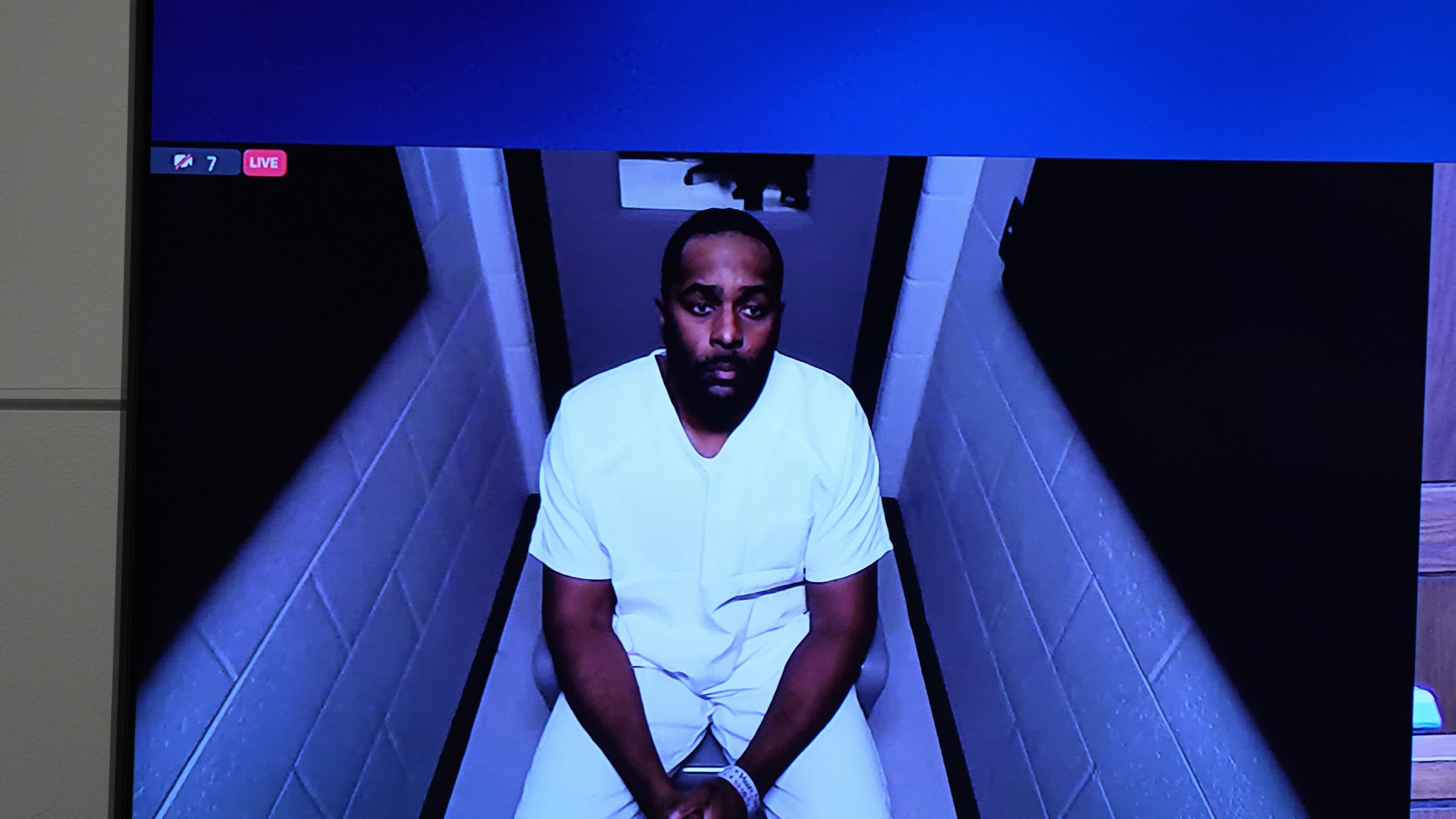 Michigan football coach Sherrone Moore appears via video in court on Friday, Dec. 12, 2025 in Ann Arbor, Mich. (AP Photo/ Ryan Sun)\