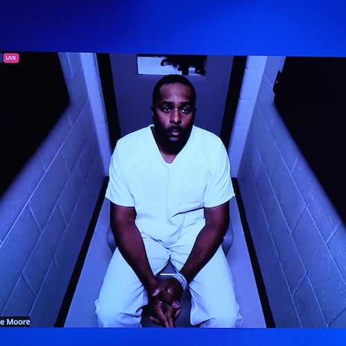 Michigan football coach Sherrone Moore appears via video in court on Friday, Dec. 12, 2025 in Ann Arbor, Mich. (AP Photo/ Ryan Sun)\