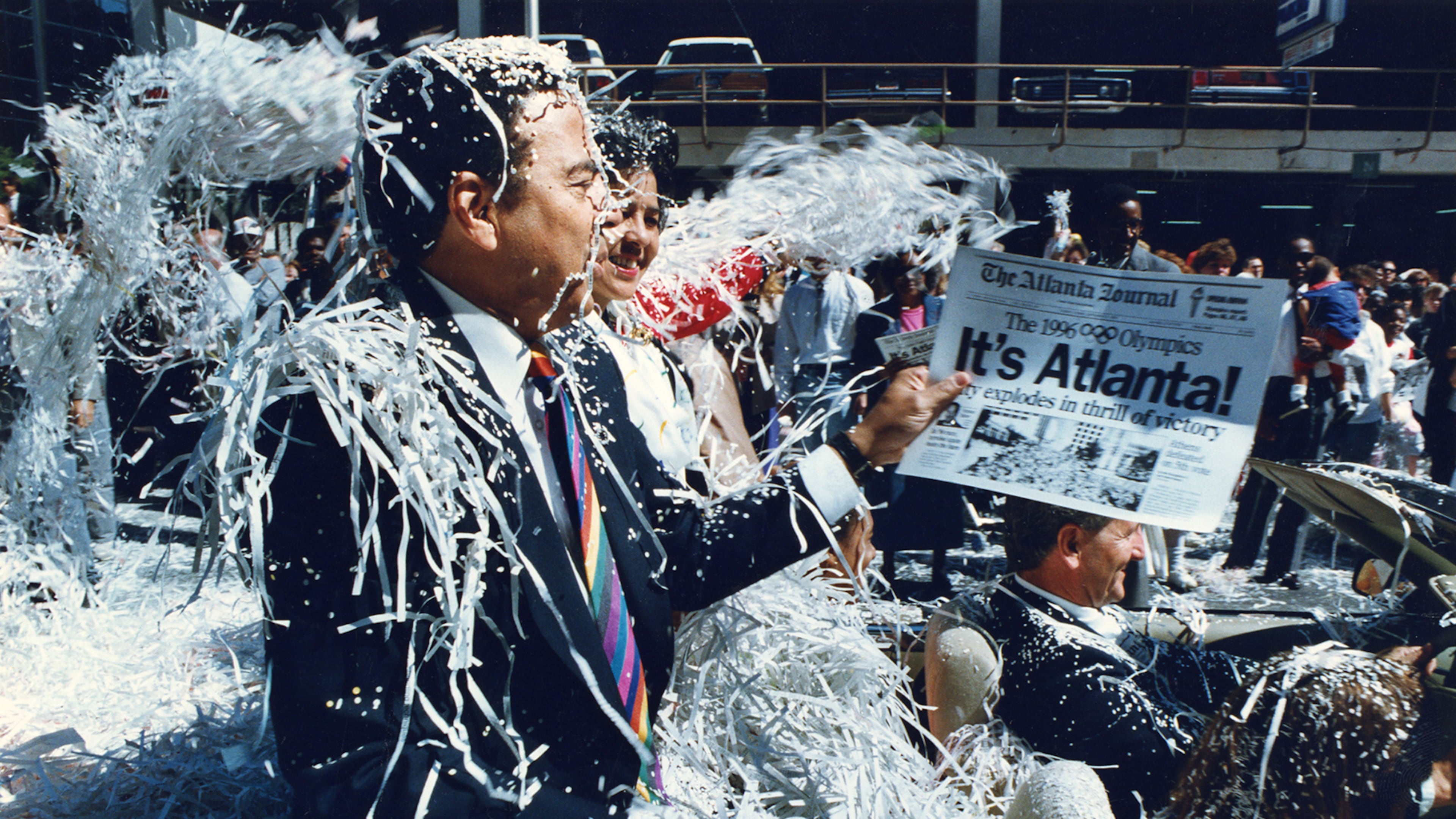 In 1990, the International Olympic Committee selected Atlanta as the host city for the 1996 Summer Olympics. Atlanta Mayor Andrew Young, who served as co-chair of the Atlanta Olympics committee, and his wife, Jean, were bombarded with confetti during this parade soon after the selection. (Eric Williams/AJC 1990)