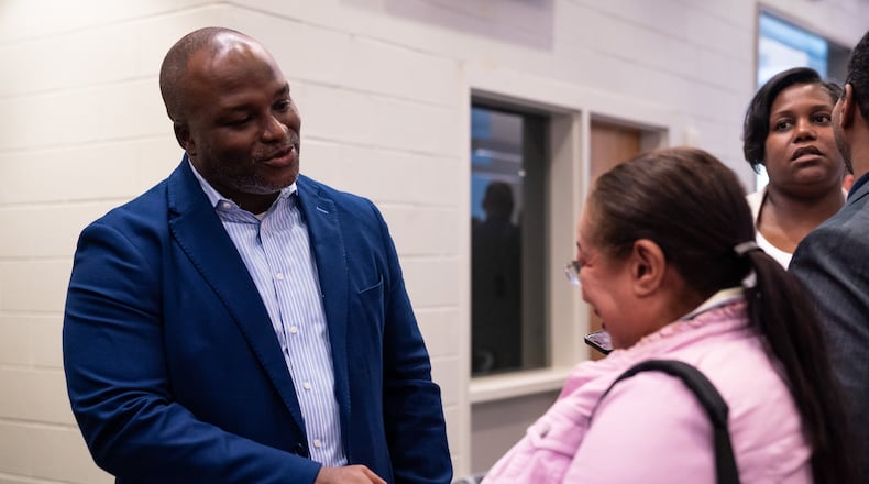 Bryan Johnson, the sole finalist for superintendent of Atlanta Public Schools, greets community members at The New Schools at Carver in Atlanta on Tuesday, June 25, 2024. (Seeger Gray / AJC)