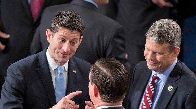 FILE -- U.S. Rep. Paul Ryan, left, shares some thoughts with his colleagues. (Ron Sachs/DPA/Zuma Press/TNS)