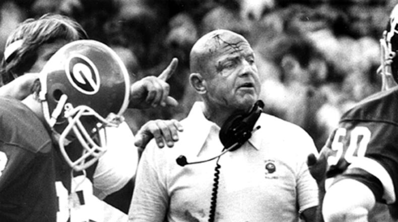 As a longtime UGA defensive coordinator, an Erk Russell trademark was to butt heads with his players, even if it meant a bloodied forehead, such as during this game in 1979. (Billy Downs /AJC file)