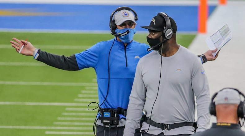 Chargers head coach Anthony Lynn, right, and offensive coordinator Shan Steichen seem to be having a lively discussion on the sideline midway through the second half as the Patriots build an insurmountable lead at SoFi Stadium. (Robert Gauthier/ Los Angeles Times/TNS)