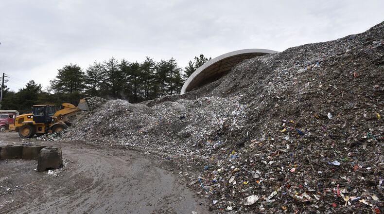 A pile of mixed recyclable materials sits at Strategic Materials recycling facility in College Park on Dec. 22. HYOSUB SHIN / HSHIN@AJC.COM