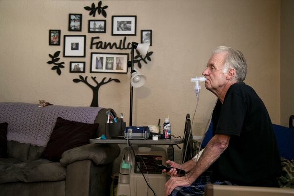 John Tagtmeir does a breathing treatment for his end-stage chronic obstructive pulmonary disease (COPD) at his daughter's apartment recently. He and his wife, who has dementia, had to move in with their daughter so she could care for them. He was receiving hospice care, but was dropped when he lived past the six months allowed by Medicare. He was without care for about a month, and was recently offered palliative care with once-a-month visits. He is among those who would use the benefit of Medicare advance care talks with physicians.