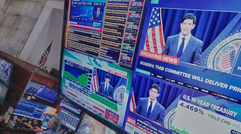 Federal Reserve Chair Kevin Warsh's press conference appears on screens on the floor of the New York Stock Exchange, Wednesday, June 17, 2026. (AP Photo/Richard Drew)