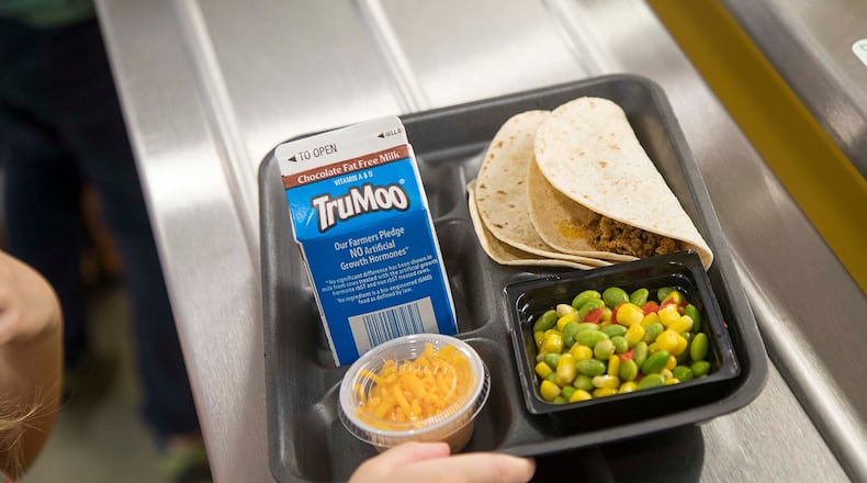 A Heards Ferry Elementary School student assembles a tray during lunch at the school in Sandy Springs, Monday, Feb. 3, 2020. ALYSSA POINTER/ALYSSA.POINTER@AJC.COM