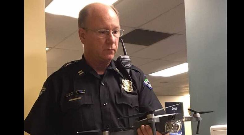 Sandy Springs Police Captain Dan Nable holds the drone.