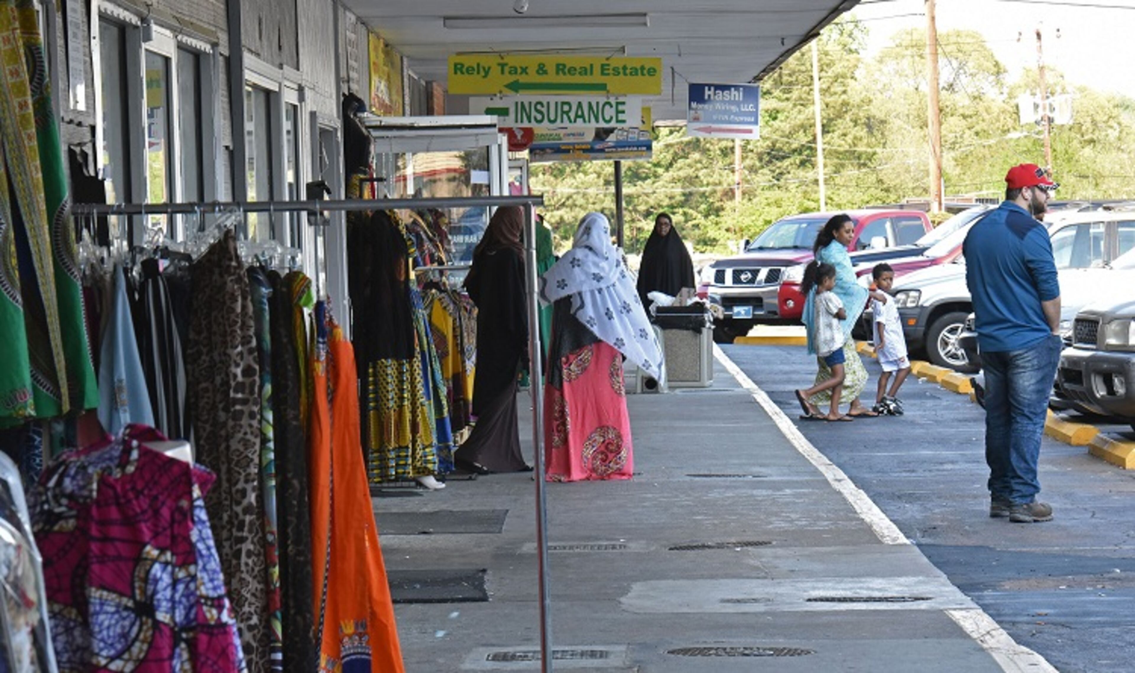 One of the Somali nationals who were recently arrested by federal immigration authorities worked at a barber shop here at Campus Plaza in Clarkston. The shopping center is popular among Somali immigrants. (Hyosub Shin/AJC)