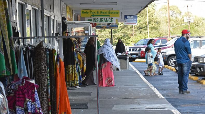 One of the Somali nationals who were recently arrested by federal immigration authorities worked at a barber shop here at Campus Plaza in Clarkston. The shopping center is popular among Somali immigrants. HYOSUB SHIN / HSHIN@AJC.COM