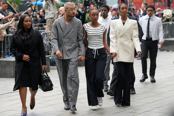 Quincy Combs, second from left, and Chance Combs center, arrive at Manhattan federal court, Tuesday, May 13, 2025, in New York. (AP Photo/Seth Wenig)