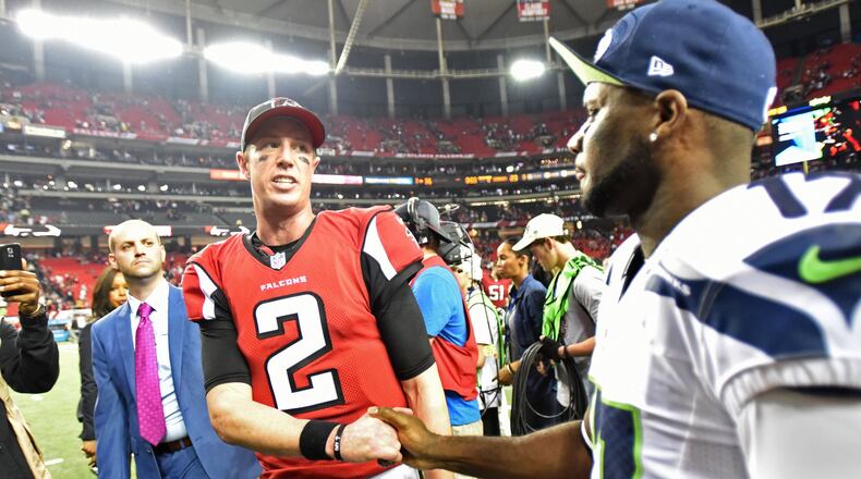 Falcons quarterback Matt Ryan (2) shakes hands with Seattle Seahawks wide receiver Devin Hester (17) after Atlanta Falcons won 36-20 during the NFC divisional playoffs at the Georgia Dome on Saturday, January 14, 2017. HYOSUB SHIN / HSHIN@AJC.COM