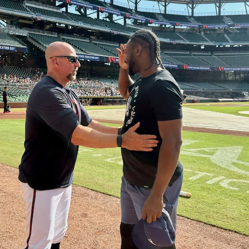 Braves manager Walt Weiss (left) and Rays infielder Jorge Mateo share a conversation before the Braves-Rays game Thursday, Sept. 10, 2026, at Truist Park. Atlanta cut Mateo in August when Ha-Seong Kim came off the injured list, and Mateo signed with Tampa Bay four days later. (Ken Sugiura/AJC)