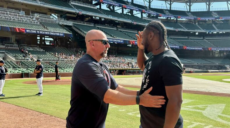 Braves manager Walt Weiss (left) and Rays infielder Jorge Mateo share a conversation before the Braves-Rays game Thursday, Sept. 10, 2026, at Truist Park. Atlanta cut Mateo in August when Ha-Seong Kim came off the injured list, and Mateo signed with Tampa Bay four days later. (Ken Sugiura/AJC)