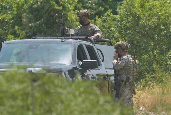 PUK forces including Asayish, SWAT and Asayish guard the Jasana Cave in Sulaymaniyah governorate, Iraq, Friday, July 11, 2025. (AP Photo/Hadi Mizban)