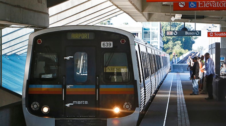 A columnist writes that MARTA could invest more money in service by raising fares, particularly to the airport. Here a train pulls into Doraville station.