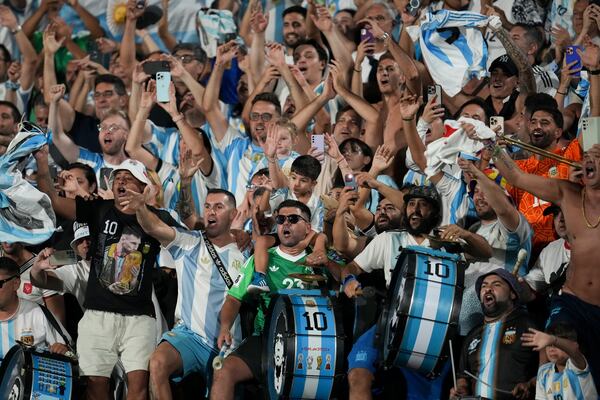 Fans of Argentina celebrate as their team defeated Uruguay during a qualifying soccer match for the FIFA World Cup 2026 in Montevideo, Uruguay, Friday, March 21, 2025. (AP Photo/Matilde Campodonico)