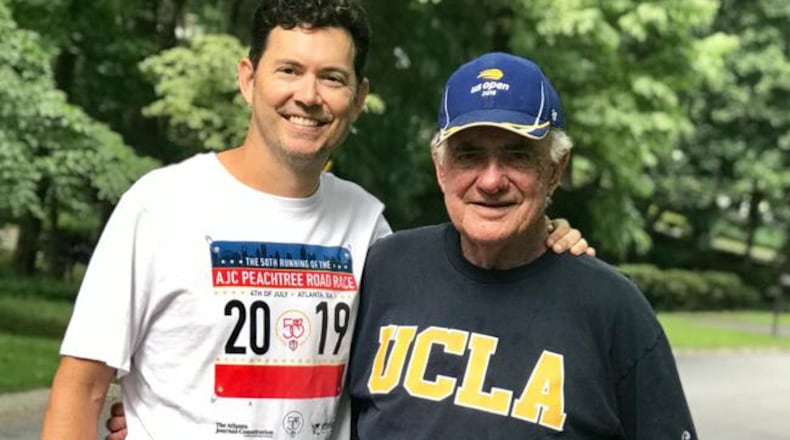 Craig Hoover, 50, with his dad Jim, 85. Hoover just ran in his 40th AJC Peachtree Road Race, in the 50th running of the event.