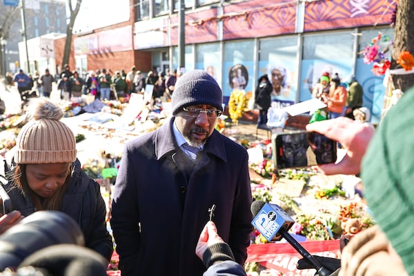 U.S. Senator Rev. Raphael Warnock, D-Ga., visits the memorial of Alex Pretti in South Minneapolis, on Jan. 27, 2026. Alex Pretti, 37 years old, was shot and killed by federal officers on January 24 in South Minneapolis while officers conducted operations in the area. (Steven Garcia/NurPhoto via AP)