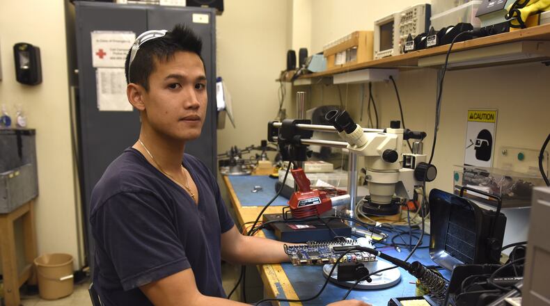 October 21, 2016, Atlanta - Kevin Pham, 29, an electronics engineer at the Georgia Institute of Technology, poses for a portrait in a lab at the Van Leer Electrical and Computer Engineering Building in Atlanta, on Friday, October 21, 2016. Pham was among those in an AJC poll who are leaning toward favoring the ballot amendment for an Opportunity School District. (DAVID BARNES / DAVID.BARNES@AJC.COM)