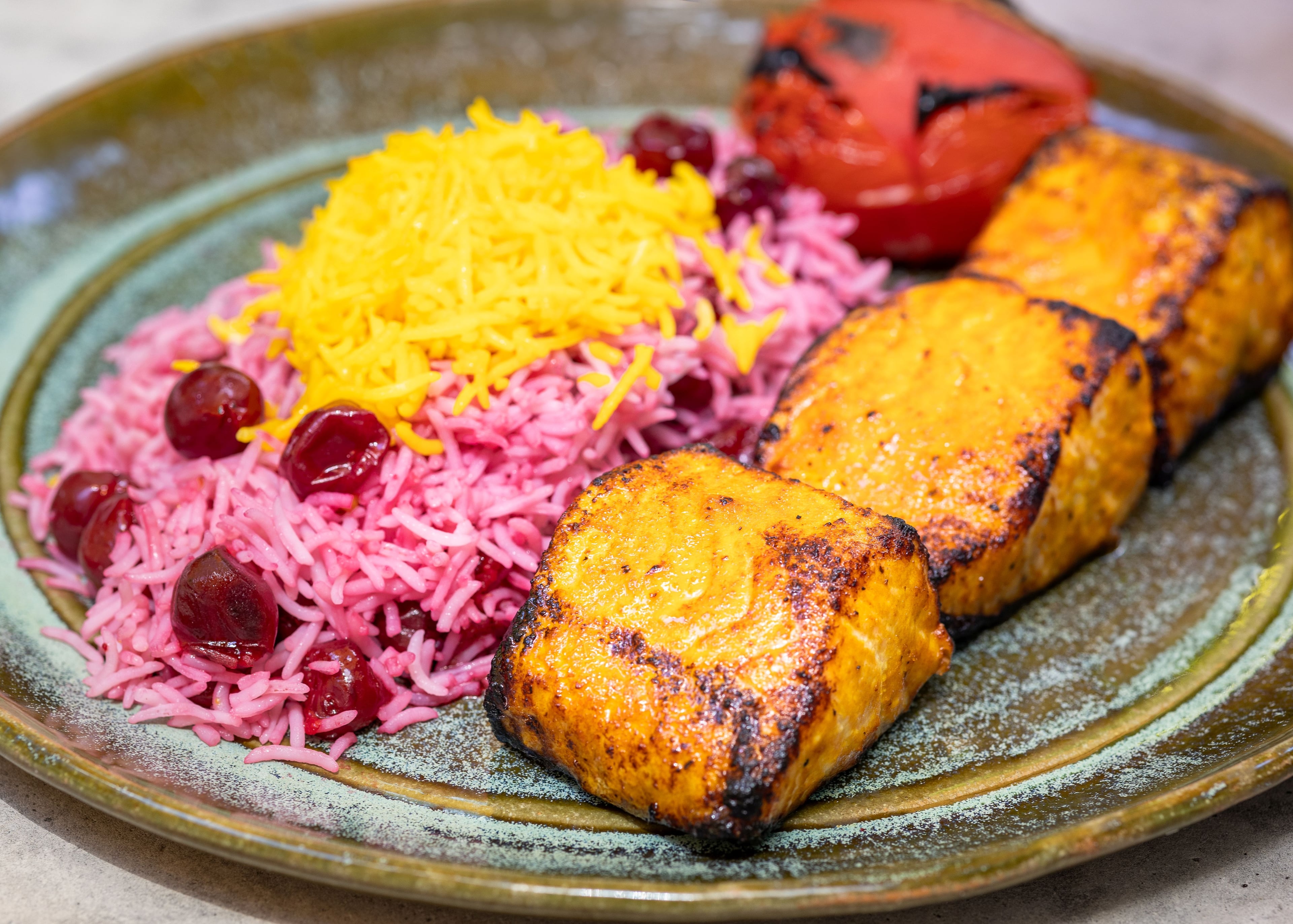 Rumi's Kitchen often serves its roasted salmon with basmati rice flavored with fava beans and dill or other herbs, but guests also enjoy the fish with a sweeter rice such as this sour cherry rice, according to Stephen Kaplan, the restaurant's chief operating officer. (Courtesy of Rumi's Kitchen)